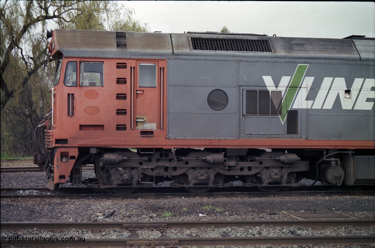 181-13
Traralgon loco depot, V/Line broad gauge loco G class G 515 Clyde Engineering EMD model JT26C-2SS serial 85-1243, cab side view.
Keywords: G-class;G515;Clyde-Engineering-Rosewater-SA;EMD;JT26C-2SS;85-1243;