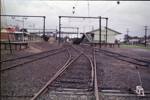 181-06
Trafalgar yard and station overview looking west, station platforms, pedestrian overbridge, AN open waggon and goods shed and loading platform.
