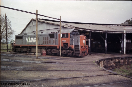 181-18
Traralgon loco depot view of turntable roads, edge of pit and roundhouse with X class X 42 Clyde Engineering EMD model G26C serial 70-705, a yellow RT class rail tractor can be seen in the roundhouse.
Keywords: X-class;X42;Clyde-Engineering-Granville-NSW;EMD;G26C;70-705;