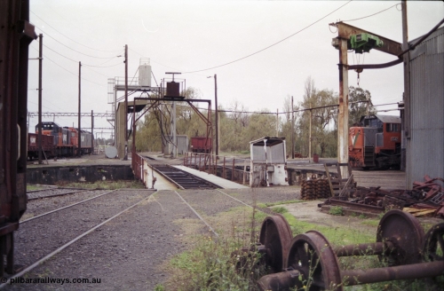 181-20
Traralgon loco depot overview of turntable and pit, fuel point and sanding plant, roundhouse, locos present are T class T 392 Clyde Engineering EMD model G8B serial 65-422, G class G 515 Clyde Engineering EMD model JT26C-2SS serial 85-1243 and X class X 42 Clyde Engineering EMD model G26C serial 70-705, HD type four wheel sand waggon HD 242 in middle of shot.
Keywords: T-class;T392;Clyde-Engineering-Granville-NSW;EMD;G8B;65-422;