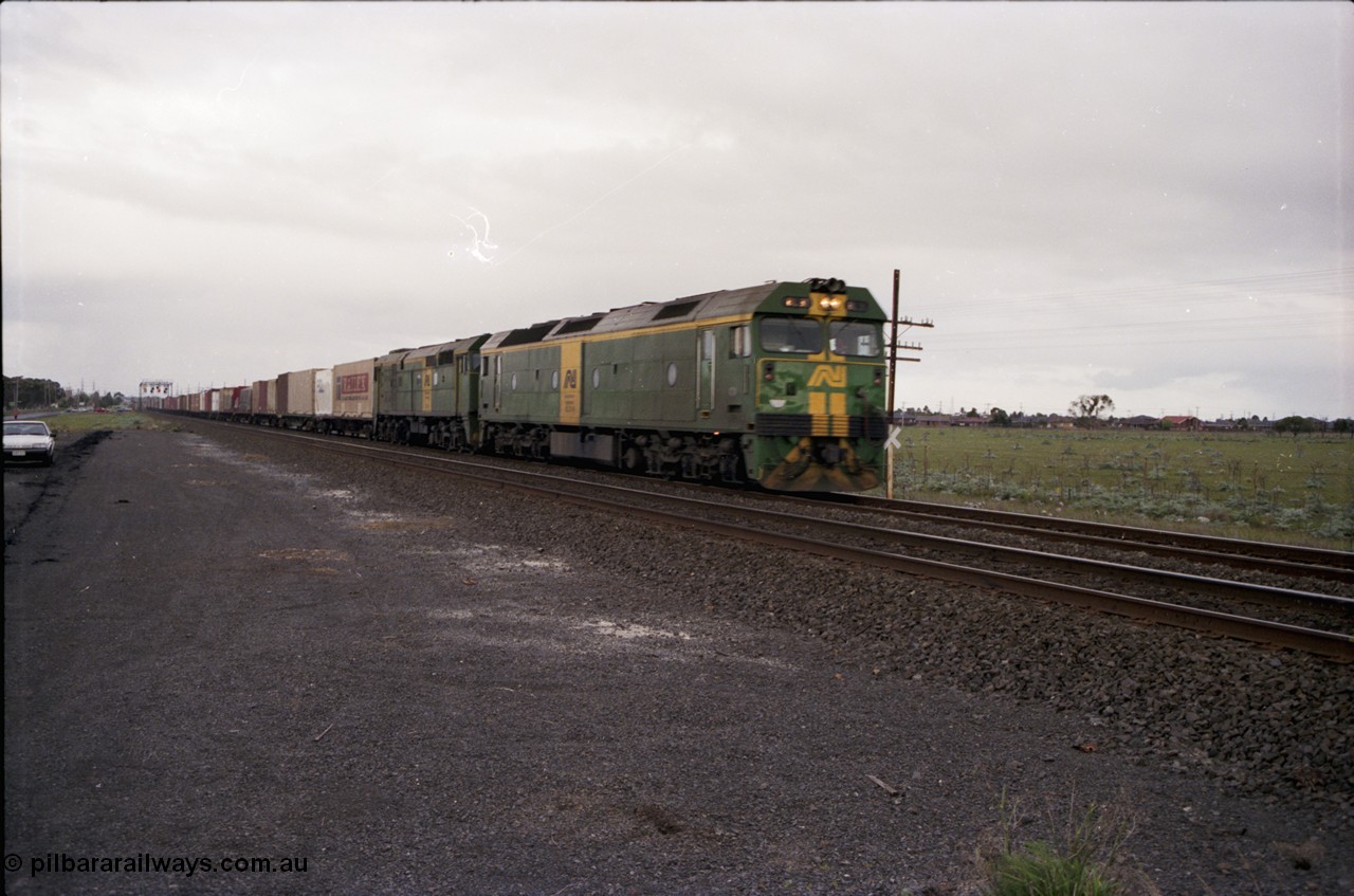 183-02
Deer Park, an Adelaide bound down broad gauge goods train behind Australian National BL class BL 31 Clyde Engineering EMD model JT26C-2SS serial 83-1015 and 700 class 705 AE Goodwin ALCo model DL500G serial G6059-3 crosses Fitzgerald Road.
Keywords: BL-class;BL31;Clyde-Engineering-Rosewater-SA;EMD;JT26C-2SS;83-1015;