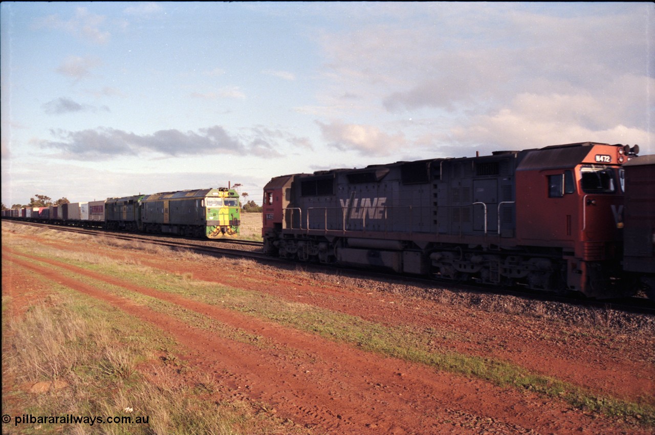 183-07
Rockbank, V/Line broad gauge N class N 472 'City of Sale' Clyde Engineering EMD model JT22HC-2 serial 87-1201 runs along the loop with an up passenger train while down Adelaide bound goods train behind Australian National locomotives BL class BL 31 Clyde Engineering EMD model JT26C-2SS serial 83-1015 and 700 class 705 AE Goodwin ALCo model DL500G serial G6059-3 stands on the mainline.
Keywords: N-class;N472;Clyde-Engineering-Somerton-Victoria;EMD;JT22HC-2;87-1201;