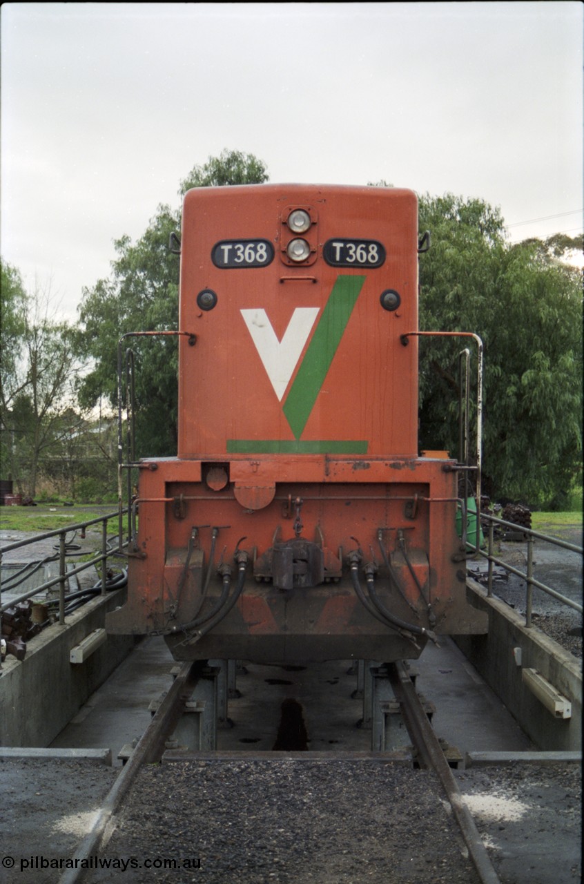 183-14
Seymour loco depot, V/Line broad gauge loco T class T 368 Clyde Engineering EMD model G8B serial 64-323 sits over the brake pit, front view.
Keywords: T-class;T368;Clyde-Engineering-Granville-NSW;EMD;G8B;64-323;