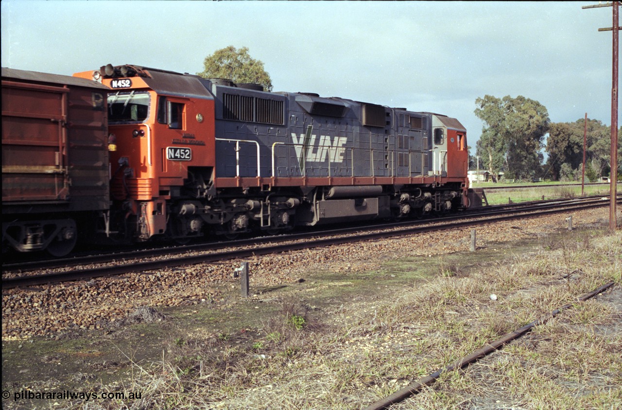 183-15
Violet Town, a V/Line broad gauge up Albury passenger train behind N class N 452 'Rural City of Wodonga' Clyde Engineering EMD model JT22HC-2 serial 85-1220 pauses at the platform, trailing view.
Keywords: N-class;N452;Clyde-Engineering-Somerton-Victoria;EMD;JT22HC-2;85-1220;