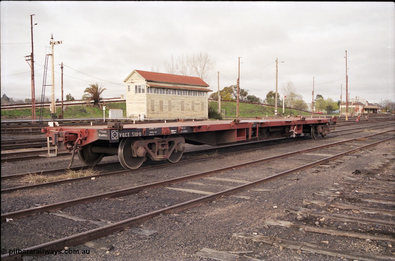 183-17
Benalla yard view, removed tracks, V/Line broad gauge VQCX type 60 foot bogie container waggon VQCX 510 stands in the yard built in May 1969 by Victorian Railways Newport Workshops as an FQX type, recoded to FQF in 1978, then VQCY in 1979 and then VQCX in 1988, Benalla B Signal Box and station are visible, along with some still standing mechanical signals.
Keywords: VQCX-type;VQCX510;Victorian-Railways-Newport-WS;FQX-type;