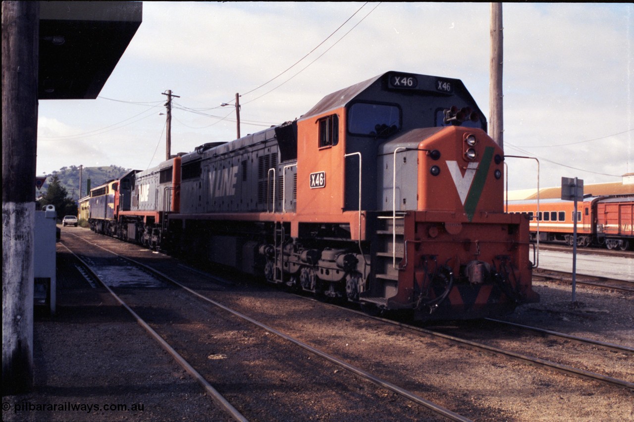 183-20
Wodonga loco depot fuel point, V/Line broad gauge X class locos X 46 Clyde Engineering EMD model G26C serial 75-793, X 45 'Edgar H Brownbill' serial 75-792 and B class B 75 Clyde Engineering EMD model ML2 serial ML2-16 which still wears the Victorian Railways livery await their next turn of duty, the station is to the right.
Keywords: X-class;X46;Clyde-Engineering-Rosewater-SA;EMD;G26C;75-793;