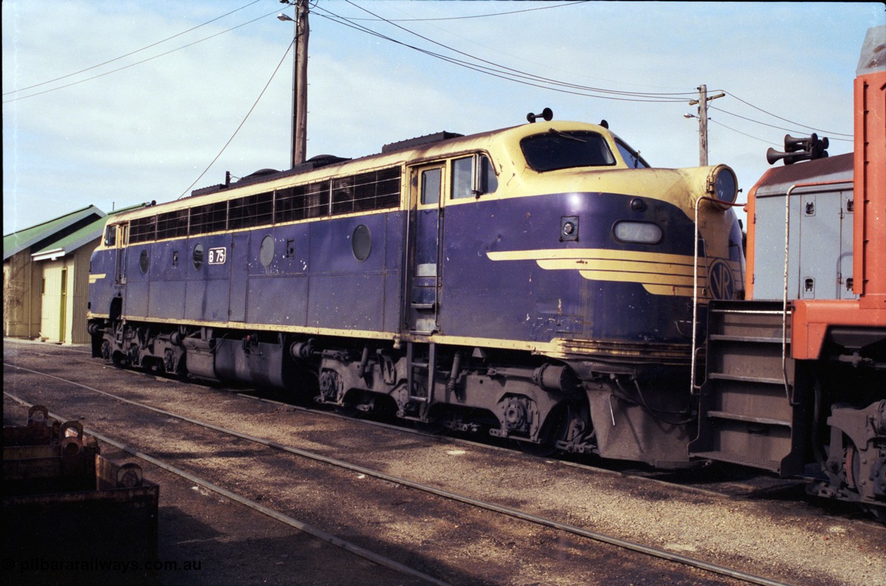 183-21
Wodonga loco depot fuel point, V/Line broad gauge Bulldog B class locomotive B 75 Clyde Engineering EMD model ML2 serial ML2-16 still in Victorian Railways livery.
Keywords: B-class;B75;Clyde-Engineering-Granville-NSW;EMD;ML2;ML2-16;bulldog;