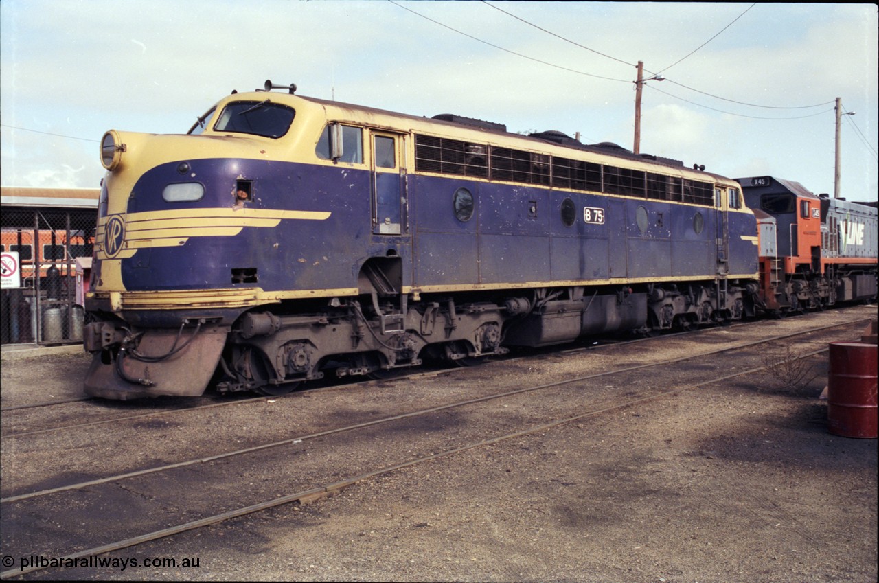 183-24
Wodonga loco depot fuel point, V/Line broad gauge Bulldog B class locomotive B 75 Clyde Engineering EMD model ML2 serial ML2-16 still in Victorian Railways livery.
Keywords: B-class;B75;Clyde-Engineering-Granville-NSW;EMD;ML2;ML2-16;bulldog;