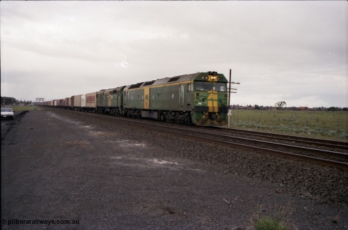183-02
Deer Park, an Adelaide bound down broad gauge goods train behind Australian National BL class BL 31 Clyde Engineering EMD model JT26C-2SS serial 83-1015 and 700 class 705 AE Goodwin ALCo model DL500G serial G6059-3 crosses Fitzgerald Road.
Keywords: BL-class;BL31;Clyde-Engineering-Rosewater-SA;EMD;JT26C-2SS;83-1015;