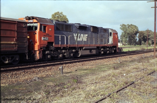 183-15
Violet Town, a V/Line broad gauge up Albury passenger train behind N class N 452 'Rural City of Wodonga' Clyde Engineering EMD model JT22HC-2 serial 85-1220 pauses at the platform, trailing view.
Keywords: N-class;N452;Clyde-Engineering-Somerton-Victoria;EMD;JT22HC-2;85-1220;