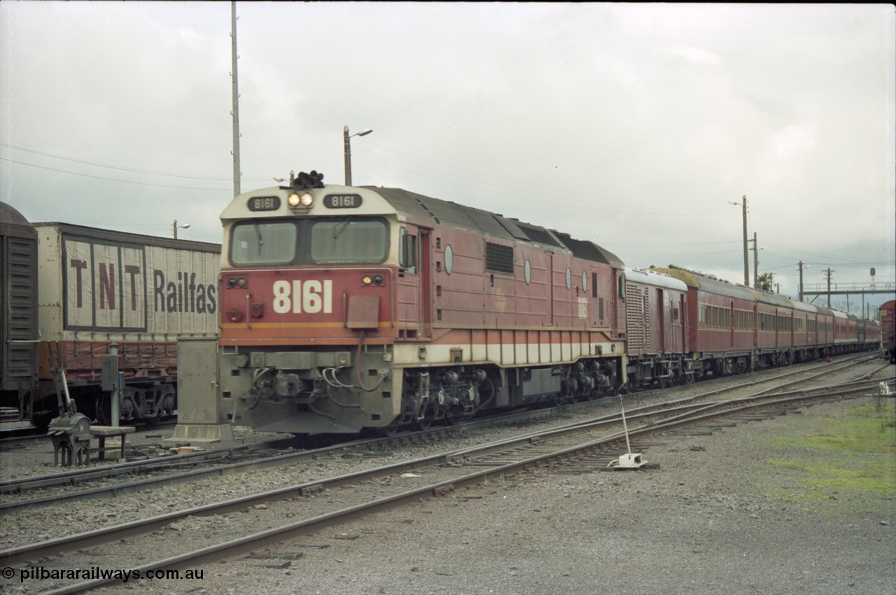 184-02
Albury station yard, standard gauge NSWSRA 81 class 8161 Clyde Engineering EMD model JT26C-2SS serial 84-1080 in candy livery leads a special 'Phantom of the Opera' passenger train bound for Sydney past 2 lever ground frame H.
Keywords: 81-class;8161;Clyde-Engineering-Kelso-NSW;EMD;JT26C-2SS;84-1080;