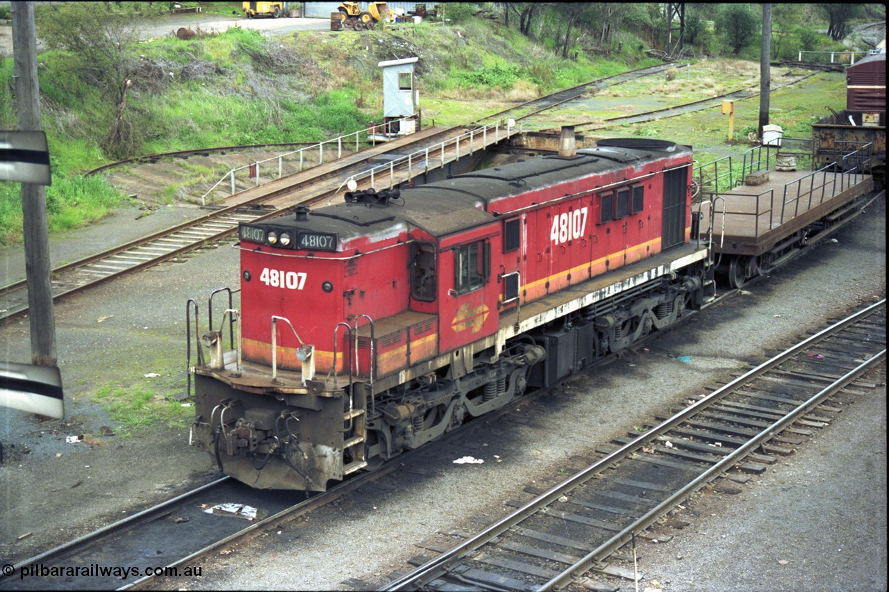 184-09
Albury loco depot, view across yard, NSWSRA standard gauge candy liveried 48 class yard shunt loco 48107 AE Goodwin ALCo model DL531 serial G3420-22, shunters float, turntable and pit, elevated view.
Keywords: 48-class;48107;AE-Goodwin;ALCo;DL531;G3420-22;