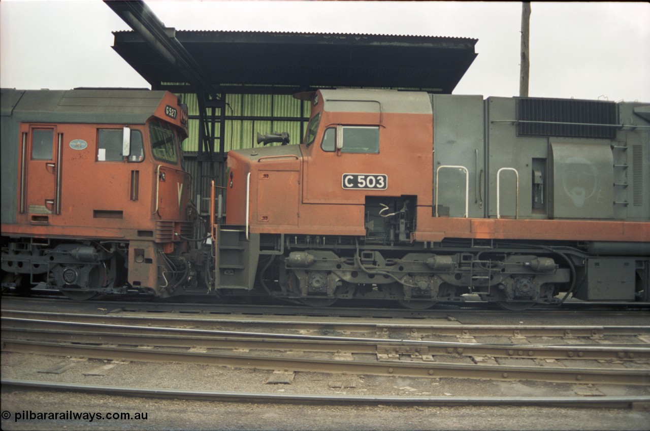 184-14
Albury loco depot fuel point, standard gauge V/Line C class loco C 503 Clyde Engineering EMD model GT26C serial 76-826, cab side view, detail of bogie and staff exchanger, coupled to G class G 527 Clyde Engineering EMD model JT26C-2SS serial 88-1257.
Keywords: C-class;C503;Clyde-Engineering-Rosewater-SA;EMD;GT26C;76-826;G-class;G527;JT26C-2SS;88-1257;