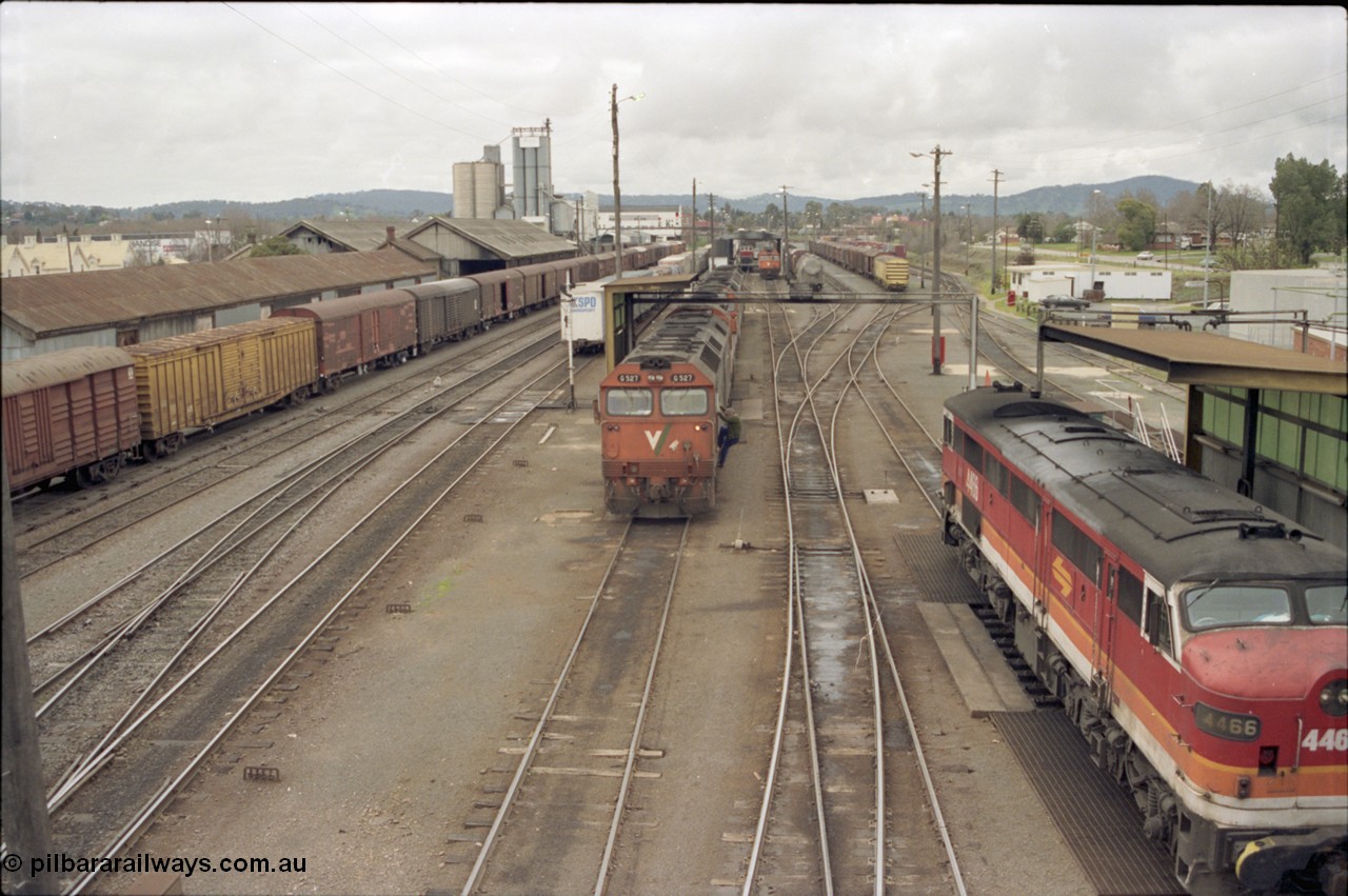 184-20
Albury station yard overview, loco depot, V/Line standard gauge G class G 527 Clyde Engineering EMD model JT26C-2SS serial 88-1257 receives attention prior to heading back to Melbourne with a south bound goods, NSWSRA standard gauge candy liveried 44 class 4466 AE Goodwin ALCo model DL500B serial G3421-06 stands at the other fuel point on the right.
Keywords: G-class;G527;Clyde-Engineering-Somerton-Victoria;EMD;JT26C-2SS;88-1257;44-class;4466;AE-Goodwin;ALCo;DL500B;G3421-6;