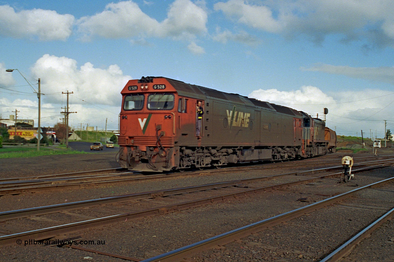 185-25
North Geelong C Box, empty grain train behind G class G 528 Clyde Engineering EMD model JT26C-2SS serial 88-1258 and X class X 41 Clyde Engineering EMD model G26C serial 70-704 as they pass North Geelong C Box, shunter in cab doorway, ground dwarf disc signal 18 in the foreground.
Keywords: G-class;G528;Clyde-Engineering-Somerton-Victoria;EMD;JT26C-2SS;88-1258;