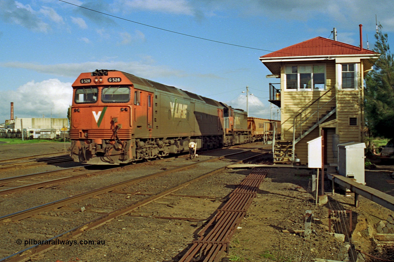 185-27
North Geelong C Box, empty grain train behind G class G 528 Clyde Engineering EMD model JT26C-2SS serial 88-1258 and X class X 41 Clyde Engineering EMD model G26C serial 70-704 shunt back into the yard past North Geelong C Box, point rodding and ground dwarf disc signal 18.
Keywords: G-class;G528;Clyde-Engineering-Somerton-Victoria;EMD;JT26C-2SS;88-1258;