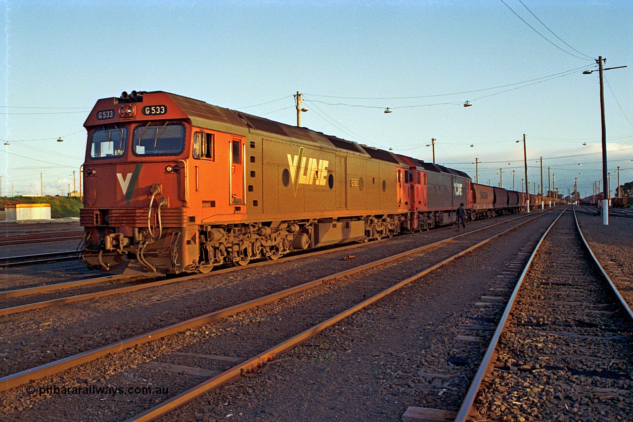 185-33
North Geelong Yard, V/Line pair of G class, G 533 Clyde Engineering EMD model JT26C-2SS serial 88-1263 and a sister conduct their brake test prior to departure with down empty grain train 9125.
Keywords: G-class;G533;Clyde-Engineering-Somerton-Victoria;EMD;JT26C-2SS;88-1263;