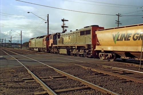 185-26
North Geelong C Box, Separation Street grade crossing, empty grain train behind G class G 528 Clyde Engineering EMD model JT26C-2SS serial 88-1258 and X class X 41 Clyde Engineering EMD model G26C serial 70-704 pass semaphore signal post 14 as they shunt up the mainline prior to setting back into the yard.
Keywords: X-class;X41;Clyde-Engineering-Granville-NSW;EMD;G26C;70-704;