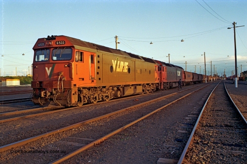 185-33
North Geelong Yard, V/Line pair of G class, G 533 Clyde Engineering EMD model JT26C-2SS serial 88-1263 and a sister conduct their brake test prior to departure with down empty grain train 9125.
Keywords: G-class;G533;Clyde-Engineering-Somerton-Victoria;EMD;JT26C-2SS;88-1263;