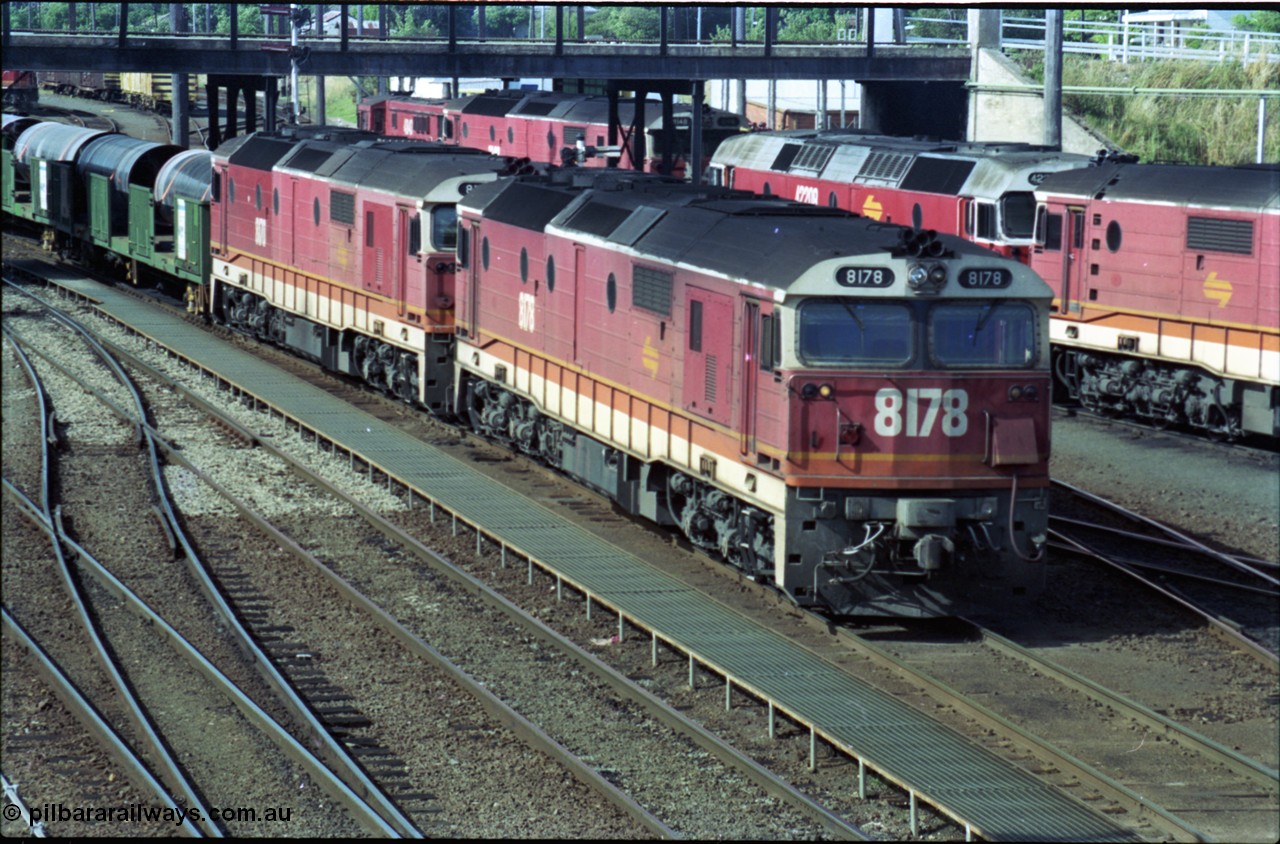 189-27
Albury yard view, double NSWSRA 81 class locomotives 8178 Clyde Engineering EMD model JT26C-2SS serial 85-1097 and 8170 serial 85-1089 wearing the candy livery on the point of an Victorian bound goods train, stabled locos stand in the depot to the right of the train.
Keywords: 81-class;8178;Clyde-Engineering-Kelso-NSW;EMD;JT26C-2SS;85-1097;