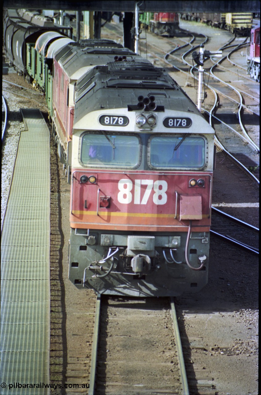 189-28
Albury yard view, double NSWSRA 81 class locomotives 8178 Clyde Engineering EMD model JT26C-2SS serial 85-1097 and 8170 wearing the candy livery on the point of an Victorian bound goods train, cab front vertical view.
Keywords: 81-class;8178;Clyde-Engineering-Kelso-NSW;EMD;JT26C-2SS;85-1097;