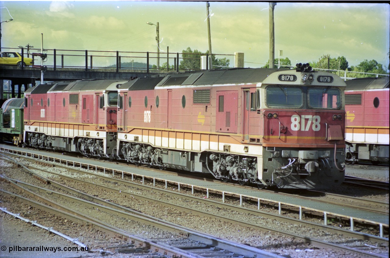 189-30
Albury yard view, double NSWSRA 81 class locomotives 8178 Clyde Engineering EMD model JT26C-2SS serial 85-1097 and 8170 serial 85-1089 wearing the candy livery on the point of an Victorian bound goods train, stabled locos stand in the depot to the right of the train.
Keywords: 81-class;8178;Clyde-Engineering-Kelso-NSW;EMD;JT26C-2SS;85-1097;