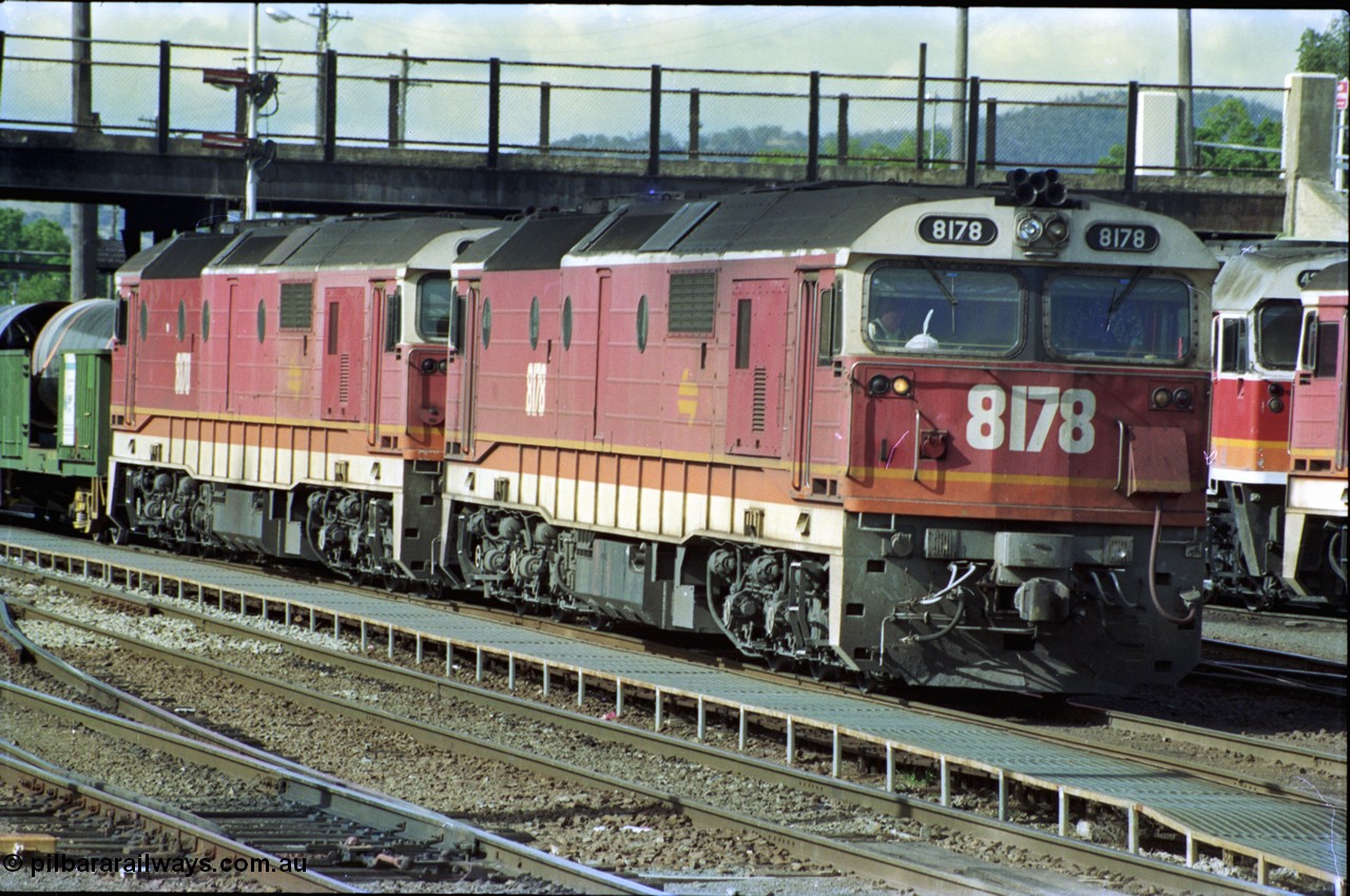 189-31
Albury yard view, double NSWSRA 81 class locomotives 8178 Clyde Engineering EMD model JT26C-2SS serial 85-1097 and 8170 serial 85-1089 wearing the candy livery on the point of an Victorian bound goods train, stabled locos stand in the depot to the right of the train.
Keywords: 81-class;8178;Clyde-Engineering-Kelso-NSW;EMD;JT26C-2SS;85-1097;