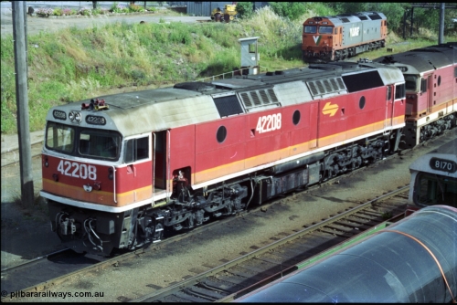 189-23
Albury, NSWSRA standard gauge loco depot with 422 class 42208 Clyde Engineering EMD model J26C serial 69-663 coupled to an 81 class and interloper V/Line G class G 519 Clyde Engineering EMD model JT26C-2SS serial 85-1232 rests off the turntable road, stabled goods train in foreground.
Keywords: 422-class;42208;Clyde-Engineering-Granville-NSW;EMD;J26C;69-663;