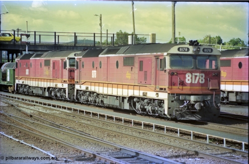 189-30
Albury yard view, double NSWSRA 81 class locomotives 8178 Clyde Engineering EMD model JT26C-2SS serial 85-1097 and 8170 serial 85-1089 wearing the candy livery on the point of an Victorian bound goods train, stabled locos stand in the depot to the right of the train.
Keywords: 81-class;8178;Clyde-Engineering-Kelso-NSW;EMD;JT26C-2SS;85-1097;