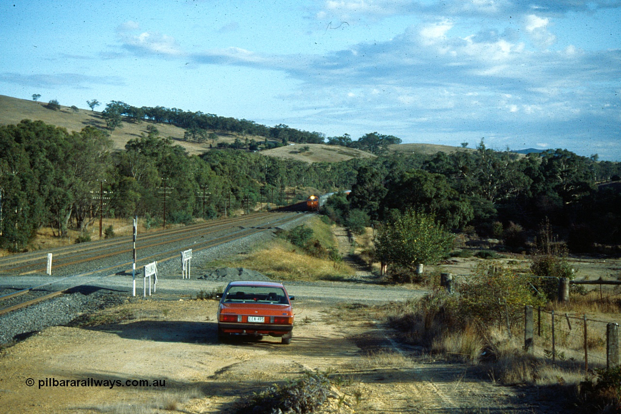 191-01
Wandong, O'Gradys Road grade crossing, near former Mathiesons Siding, UP Melbourne Express hauled by V/Line G class.
