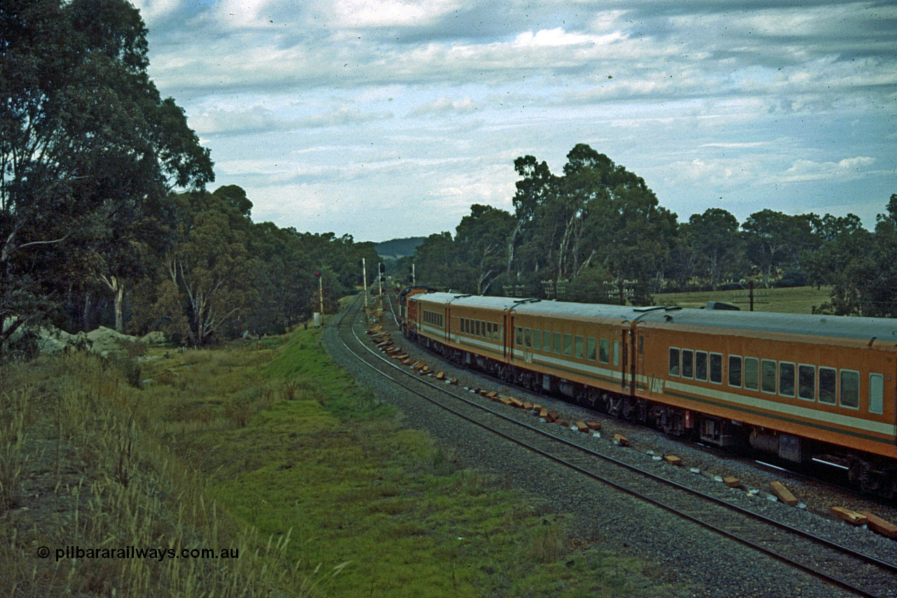 191-11
Seymour, looking south at the northern most Goulburn River bridge, end of Gordon Crescent, Seymour, quarry to the left. V/Line N class on UP Albury Pass on broad gauge, standard gauge on the left, Seymour behind photographer.
