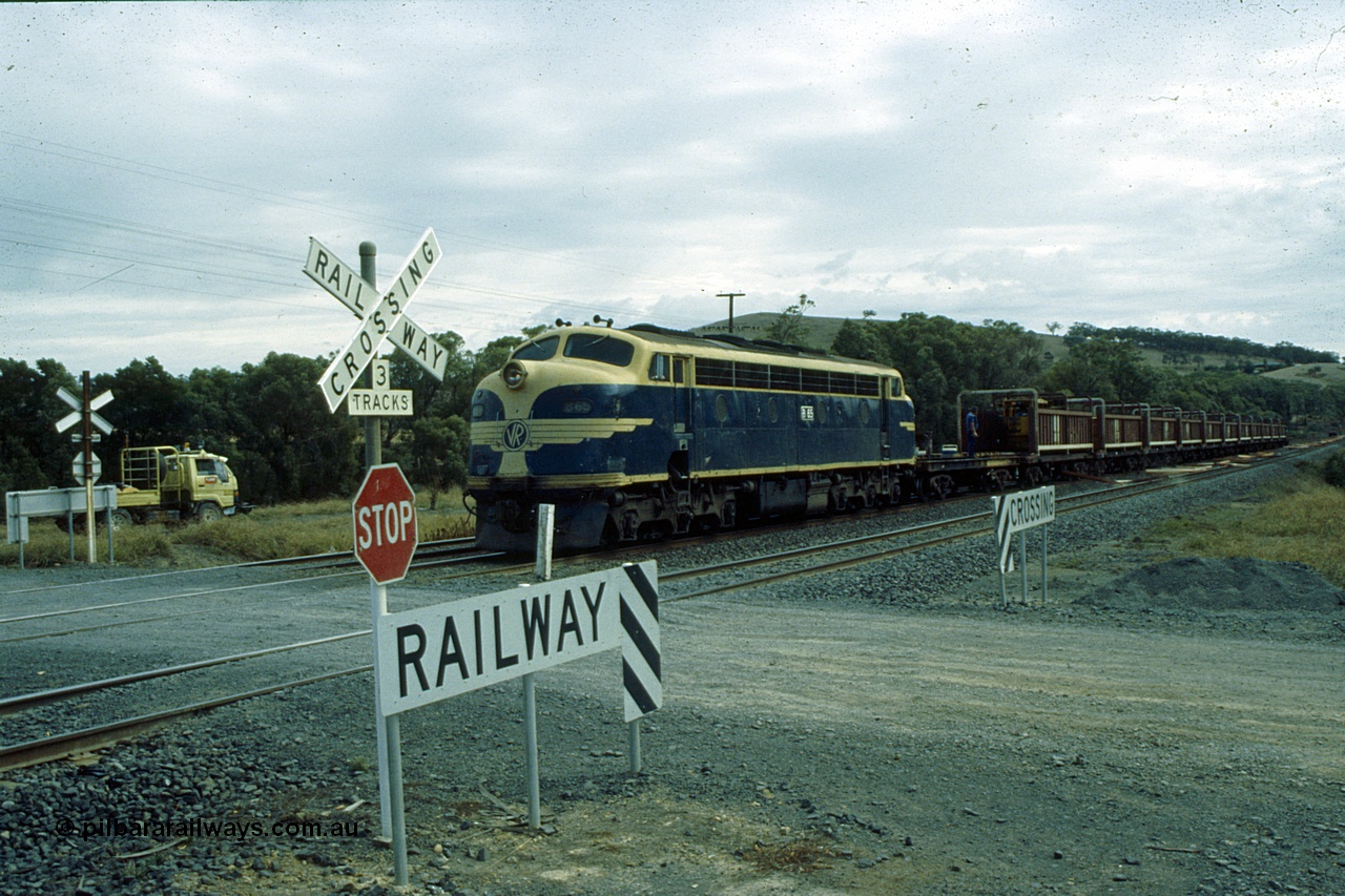 191-14
Seymour station, rationalised yard, VZCA type Sleeper Discharge Transport waggon VZCA 1 with sleeper kicker trolley on rails, recoded from QD type QD 1 in 1988, originally a TT type TT 3 built in 1890. Part of sleeper discharge train behind B class B 65.
Keywords: VZCA-type;VZCA1;Victorian-Railways-Newport-WS;QD-type;