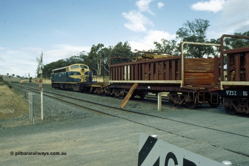 191-23
Wandong, O'Gradys Road grade crossing, near former Mathiesons Siding, Victorian Railways liveried B class B 65 Clyde Engineering EMD model ML2 serial ML2-6 leads an UP special sleeper discharge train as it discharges sleepers.
Keywords: B-class;B65;Clyde-Engineering-Granville-NSW;EMD;ML2;ML2-6;bulldog
