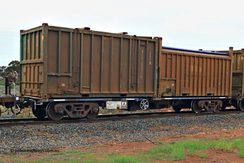240401 4991
Kalgoorlie, Aurizon's 1029 Malcolm Freighter, waggon AQIY 00013 loaded with two 20' sulphur containers, a 25U0 hard top BISU 100024[0] and a 55UA roll top Bis Industries SBIU 200636[0]. The AQIY were originally built as the CQYY but CFCLA did not buy them, Bradken then stored them as KQYY. When Aurizon bought them they had the handbrake relocated to the middle of the waggon from the end. April 1, 2024.
Keywords: AQIY-type;AQIY00013;Bradken;CQYY-type;KQYY-type;