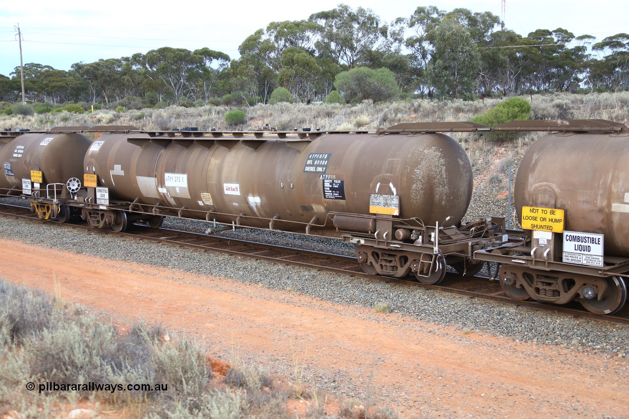 161116 5101
West Kalgoorlie, Shell fuel train 3442, tank waggon ATPF 575, built by WAGR Midland Workshops 1974 for Shell as type WJP 80.66 kL one compartment one dome.
Keywords: ATPF-type;ATPF575;WAGR-Midland-WS;WJP-type;
