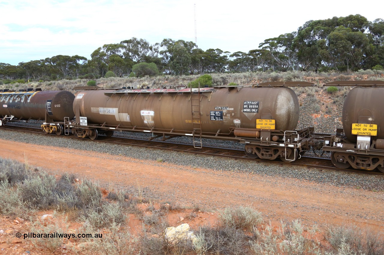 161116 5105
West Kalgoorlie, Shell fuel train 3442, ATPF type tank waggon ATPF 582, built by WAGR Midland Workshops 1976 for Shell as type WJP 80.66 kL one compartment one dome, original fleet no. 694 visible, but 717 has been written near walkway. Converted to narrow gauge 1986 and recoded JPC.
Keywords: ATPF-type;ATPF582;WAGR-Midland-WS;WJP-type;JPC-type;