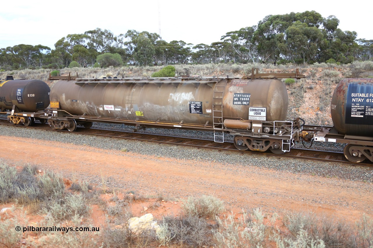 161116 5109
West Kalgoorlie, Shell fuel train 3442, tank waggon ATBY 14592, built by Westrail Midland Workshops 1981 for Bain Leasing as type JPB, 82 kL, on narrow gauge as JPBA, then SG WJPB, still visible on the roof, note vacuum brake pipe and type F InterLock coupler, also Westrail still visible on the side.
Keywords: ATBY-type;ATBY14592;Westrail-Midland-WS;JPB-type;JPBA-type;WJPB-type;