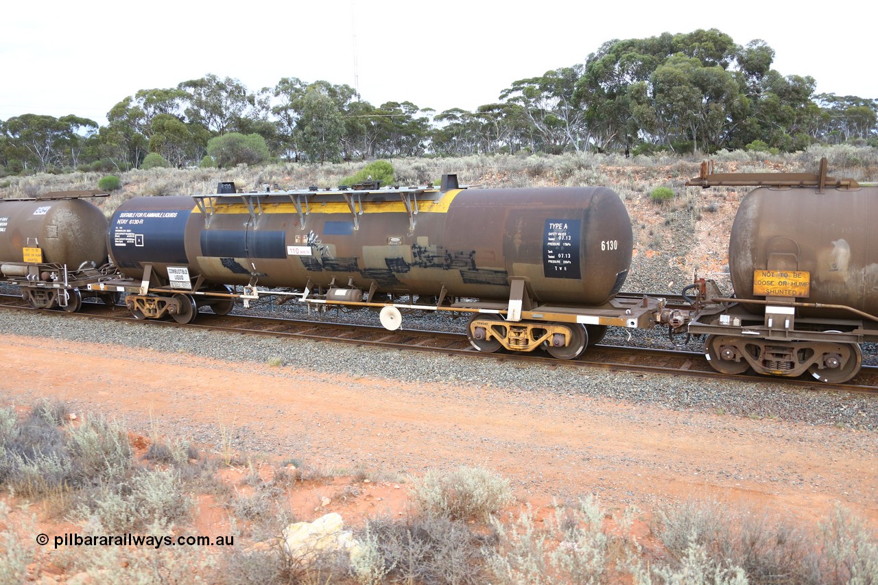 161116 5110
West Kalgoorlie, Shell fuel train 3442, tank waggon NTAY 6130, built by Indeng Qld 1979 for Shell as type SCA 281, later NTAF 281, note normal E type coupler, ATBY has type F InterLock and vacuum hose.
Keywords: NTAY-type;NTAY6130;Indeng-Qld;SCA-type;SCA281;