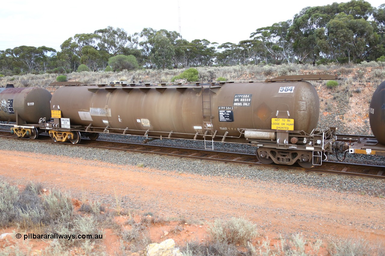 161116 5112
West Kalgoorlie, Shell fuel train 3442, tank waggon ATPF 584, built by Westrail Midland Workshops 1980 as the final Shell WJP type 80.66 kL one compartment one dome. Shell fleet no. TR719 still visible, fitted with type F InterLock couplers.
Keywords: ATPF-type;ATPF584;Westrail-Midland-WS;WJP-type;
