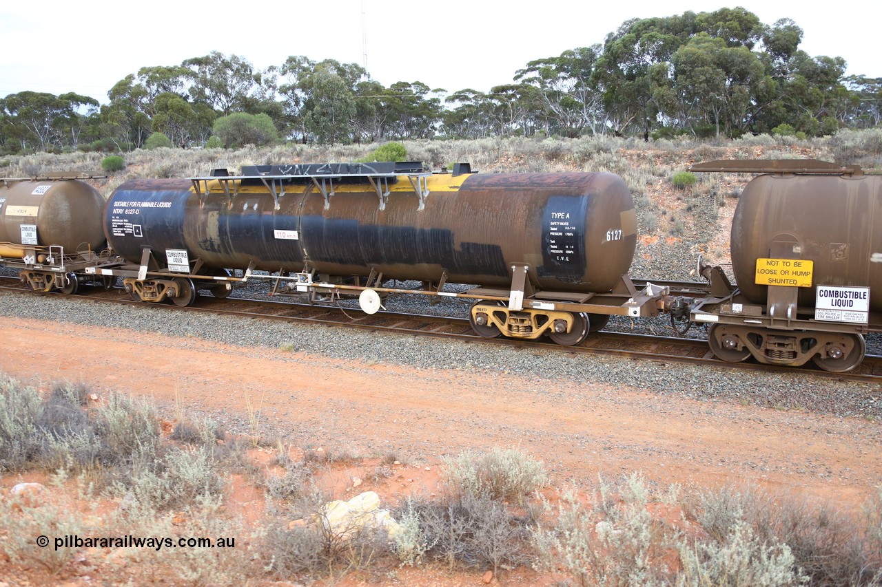 161116 5117
West Kalgoorlie, Shell fuel train 3442, tank waggon NTAY 6127, built by Indeng Qld 1976 for Shell as type SCA 278, then NTAF 278 with normal couplers.
Keywords: NTAY-type;NTAY6127;Indeng-Qld;SCA-type;SCA278;NTAF-type;
