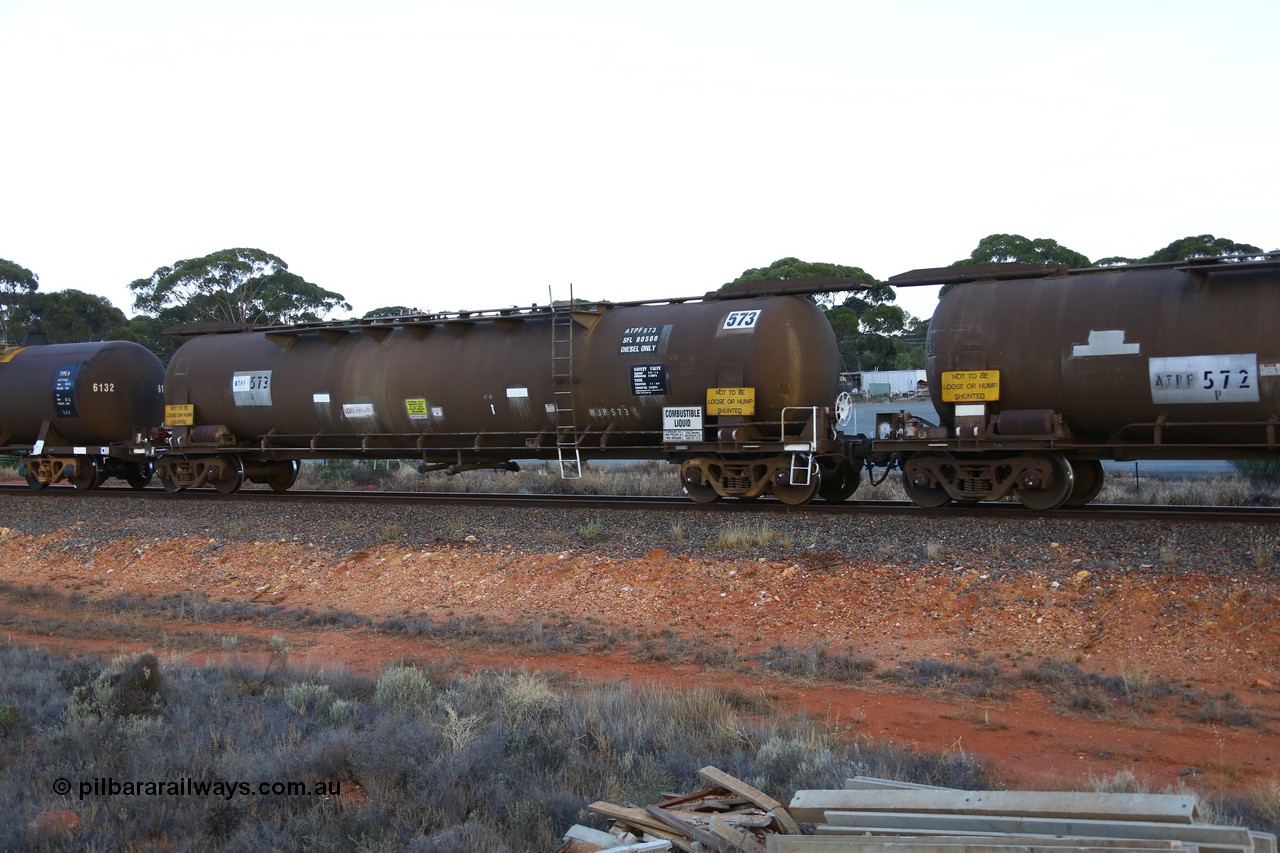 161116 5551
Binduli, empty Shell fuel train 4443, ATPF 573 fuel tank waggon built by WAGR Midland Workshops 1974 for Shell as WJP type 80.66 kL one compartment one dome, capacity of 80500 litres, Shell Fleet No. 708, old code still visible, fitted with type F InterLock couplers.
Keywords: ATPF-type;ATPF573;WAGR-Midland-WS;WJP-type;