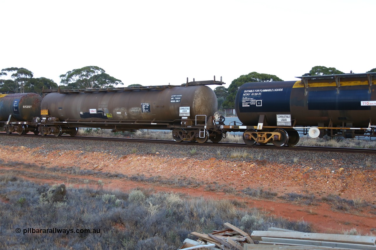 161116 5562
Binduli, empty Shell fuel train 4443, tank waggon ATBY 14592, built by Westrail Midland Workshops 1981 for Bain Leasing as type JPB, 82 kL, on narrow gauge as JPBA, then SG WJPB, note vacuum brake pipe and type F InterLock coupler.
Keywords: ATBY-type;ATBY14592;Westrail-Midland-WS;JPB-type;JPBA-type;WJPB-type;