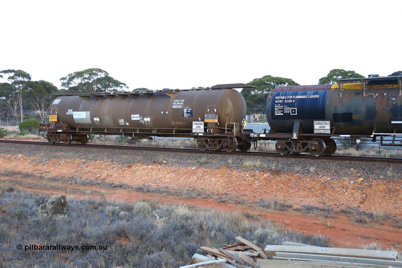 161116 5564
Binduli, empty Shell fuel train 4443, tank waggon ATPF 575, built by WAGR Midland Workshops 1974 for Shell as type WJP 80.66 kL one compartment one dome. 
Keywords: ATPF-type;ATPF575;WAGR-Midland-WS;WJP-type;