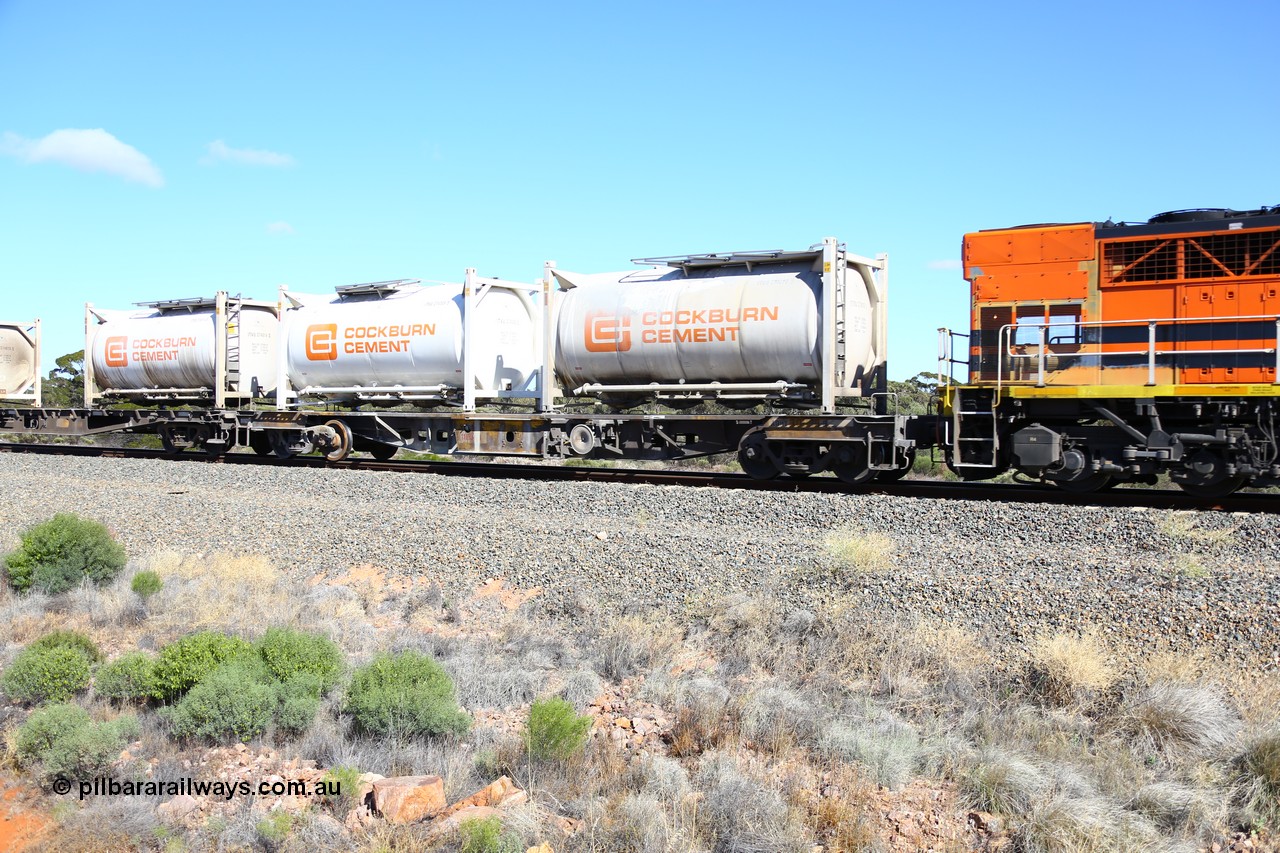 161111 2454
Binduli, Kalgoorlie Freighter train 5025, waggon AQHY 30096 loaded with two Cockburn Cement ITVU type 20' tanktainers IVTU 274016 and 274009. 30096 originally built by the WAGR Midland Workshops in 1964/66 as a WF type flat waggon, then in 1997, following several recodes and modifications, was one of seventy five waggons converted to the WQH type to carry CSA sulphuric acid tanks between Hampton/Kalgoorlie and Perth/Kwinana.
Keywords: AQHY-type;AQHY30096;WAGR-Midland-WS;WF-type;WFDY-type;WFDF-type;RFDF-type;WQH-type;