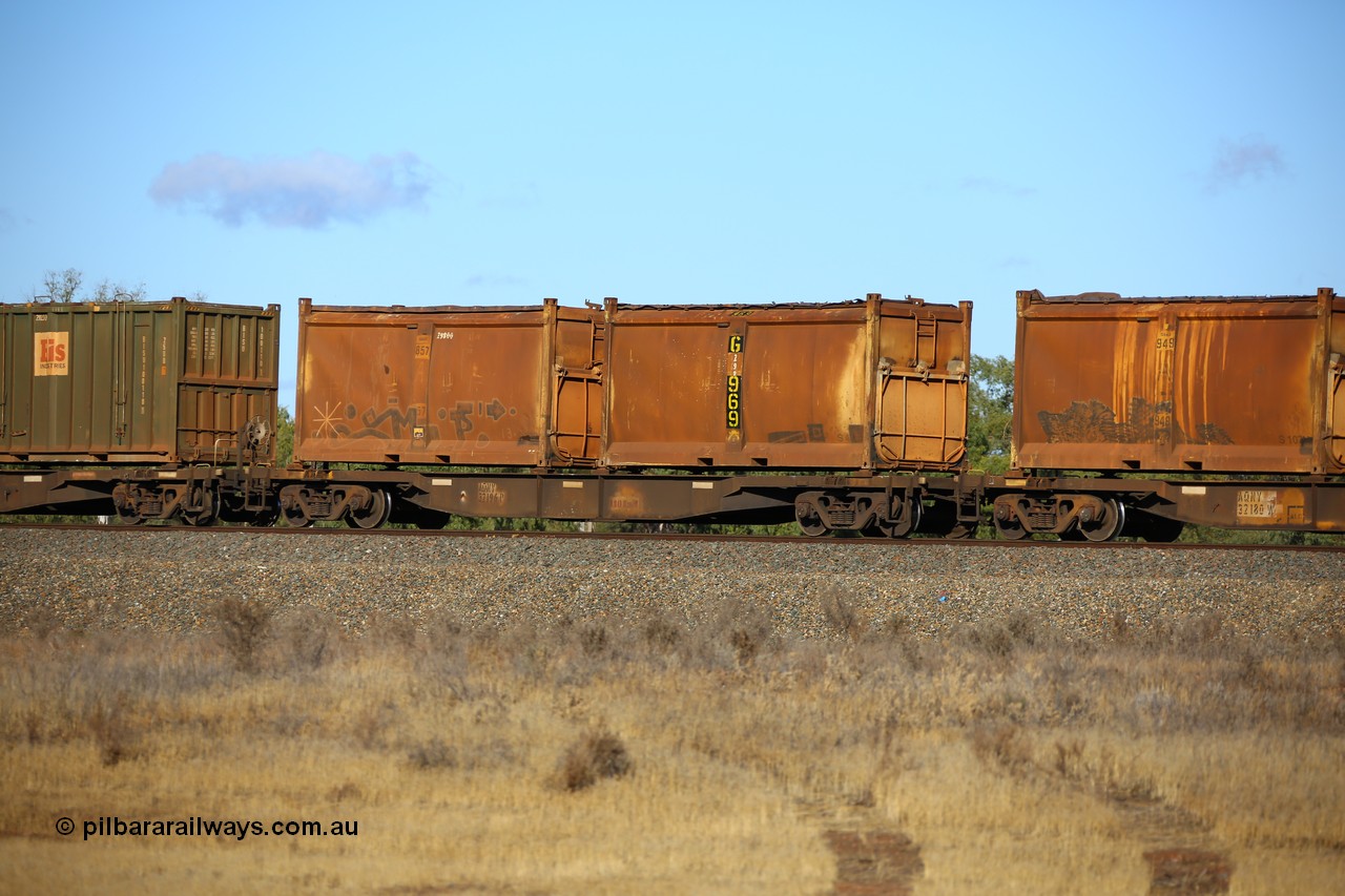 161111 2406
Kalgoorlie, Malcolm freighter train 5029, waggon AQNY 32196 one of sixty two waggons built by Goninan WA in 1998 as WQN type for Murrin Murrin container traffic with two original style sulphur containers both with original style doors and sliding tarpaulin tops. The numbers are graffitied out, G 969 and G 857.
Keywords: AQNY-type;AQNY32196;Goninan-WA;WQN-type;