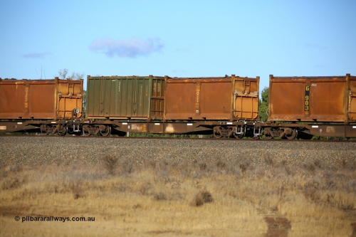 161111 2411
Kalgoorlie, Malcolm freighter train 5029, waggon AQNY 32168 one of sixty two waggons built by Goninan WA in 1998 as WQN type for Murrin Murrin container traffic with an original style sulphur container S52X 879 with original style door and sliding tarpaulin and an undecorated Bis Industries hard-top 25U0 type sulphur container BISU 100011.
Keywords: AQNY-type;AQNY32168;Goninan-WA;WQN-type;
