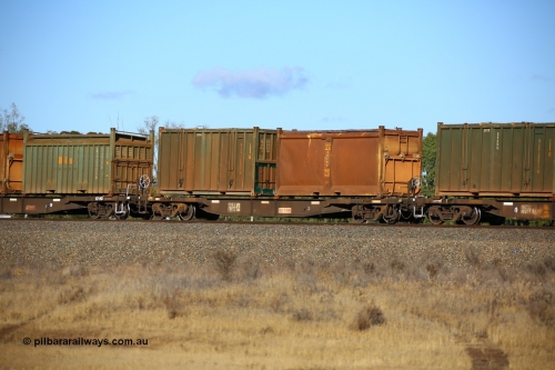 161111 2412
Kalgoorlie, Malcolm freighter train 5029, waggon AQNY 32200 one of sixty two waggons built by Goninan WA in 1998 as WQN type for Murrin Murrin container traffic with an original style sulphur container S197A 947 with original style door and sliding tarpaulin and an undecorated Bis Industries hard-top 25U0 type sulphur container BISU 100037.
Keywords: AQNY-type;AQNY32200;Goninan-WA;WQN-type;
