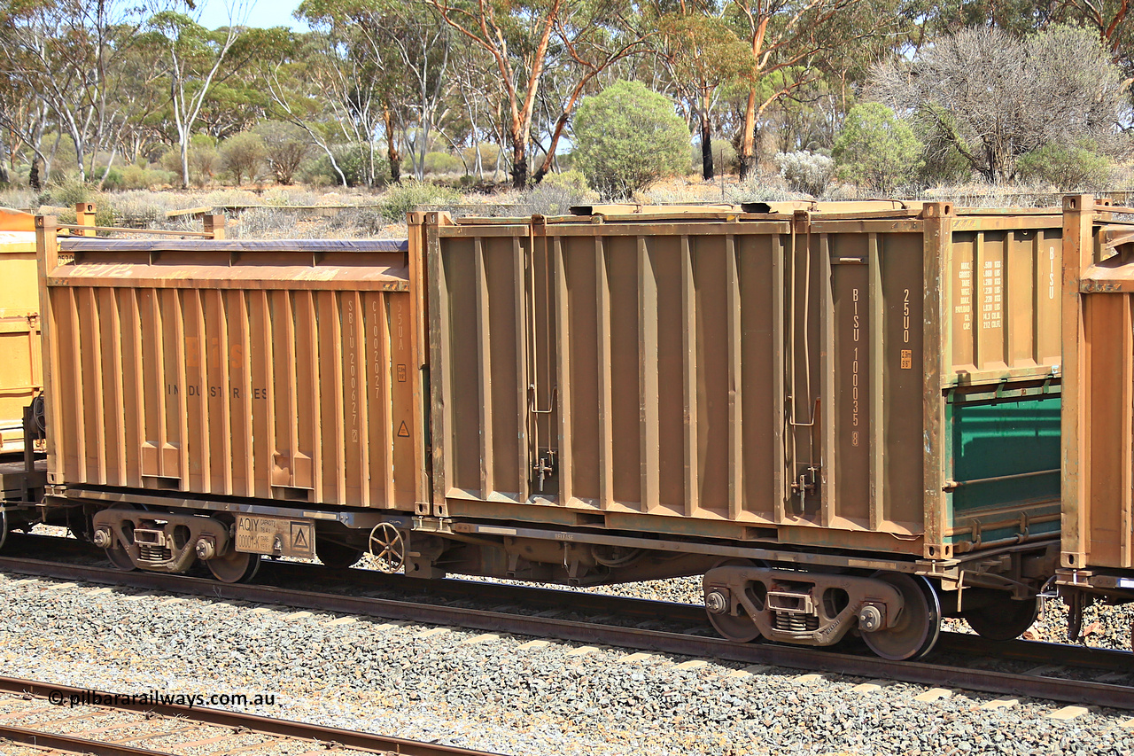 231020 8272
Binduli, 5029 Malcolm Freighter, AQIY type 40' container waggon class leader AQIY 00001 with an undecorated Bis Industries hard-top 25U0 type sulphur containers BISU 100035 and a Bis Industries 55UA roll-top sulphur container SIBU 200627. The AQIY started life built by Bradken and coded CQYY but CFCLA never bought them, so Bradken coded them KQYY and stored them. When Aurizon bought them they had the handbrake relocated to the middle of the waggon from the end.
Keywords: AQIY-type;AQIY00001;Bradken;CQYY-type;KQYY-type;