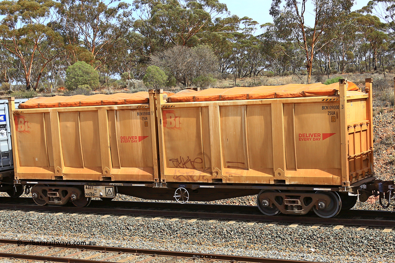 231020 8293
Binduli, 5029 Malcolm Freighter, AQIY type 40' container waggon AQIY 00021 with two Bis Deliver Every Day roll-top 25UA type sulphur containers BICN 109000 and BICN 105800. The AQIY started life built by Bradken and coded CQYY but CFCLA never bought them, so Bradken coded them KQYY and stored them. When Aurizon bought them they had the handbrake relocated to the middle of the waggon from the end.
Keywords: AQIY-type;AQIY00021;Bradken;CQYY-type;KQYY-type;