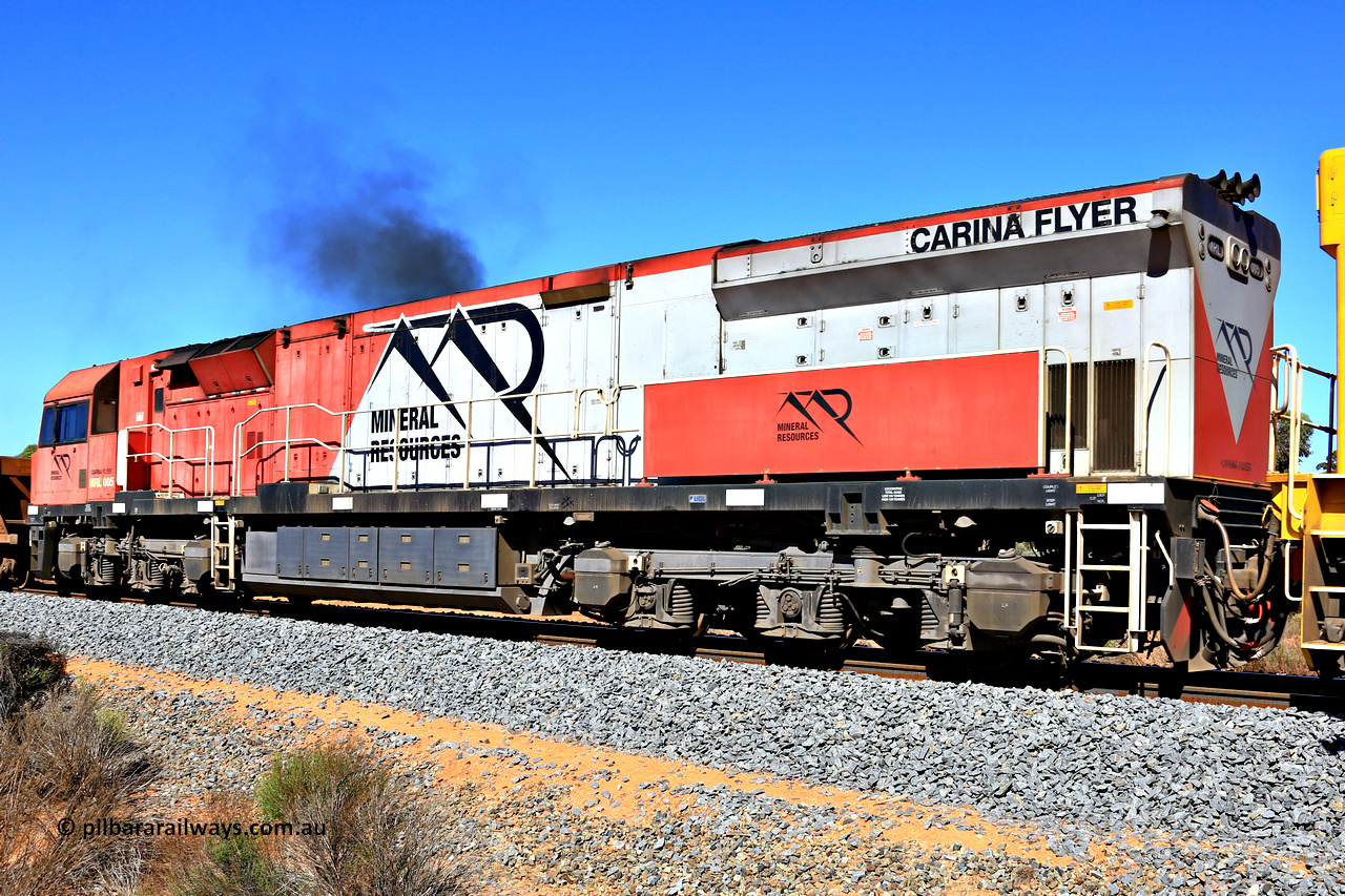 240328 2907
Feysville, Mineral Resources empty Mount Walton iron ore train 5040 with mid-train unit MRL 005 'Carina Flyer' with serial number R-0113-05/14-508 and is a UGL Rail Broadmeadow NSW built GE C44ACi model locomotive, one of six such units built for Mineral Resources in 2014. March 28, 2024.
Keywords: MRL-class;MRL005;UGL-Rail-NSW;GE;C44ACi;R-0113-05/14-508;